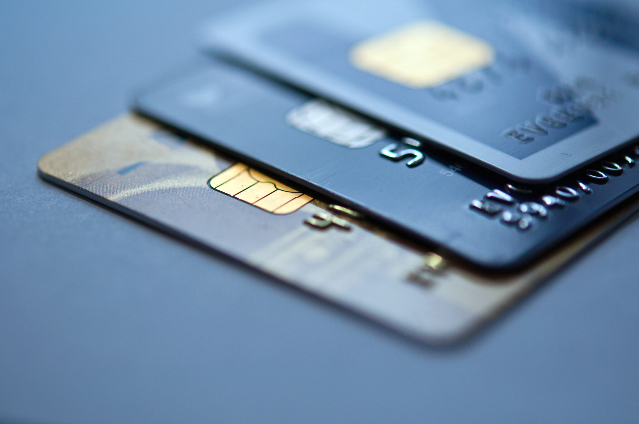 credit cards on a blue background, selective focus. closeup.